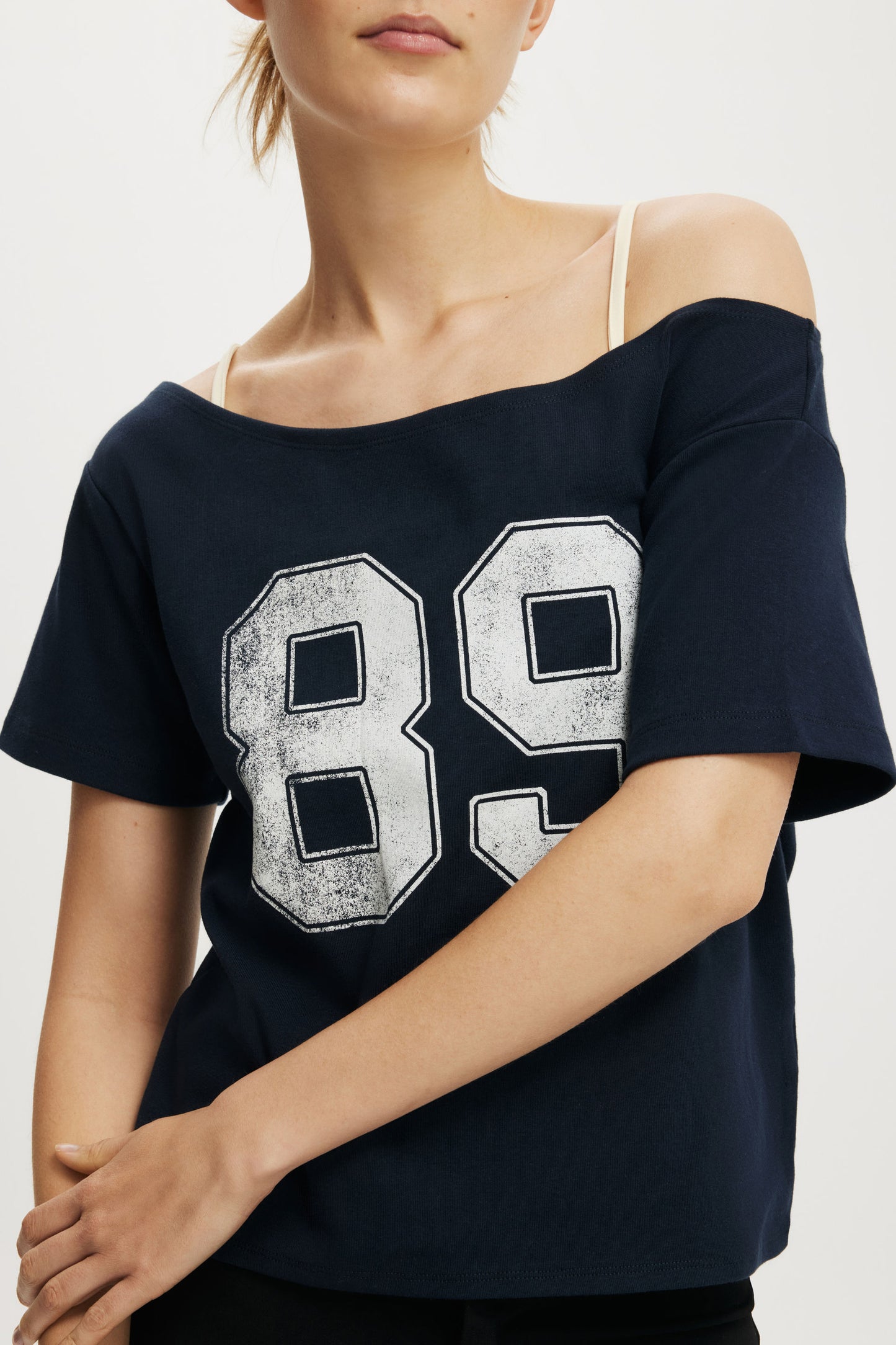 The Sporty Off Shoulder Graphic Tee